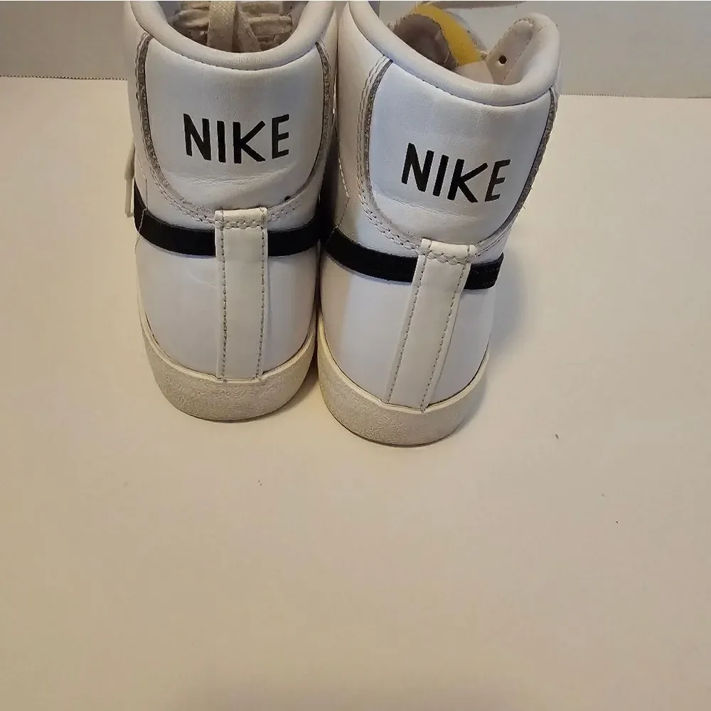 Nike leather hi top sneakers size 6. White with black swish